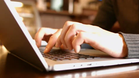 Hands touch typing on a laptop keyboard in the cafe Stock Footage 50207730