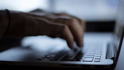 Hands touch typing on a laptop keyboard 動画素材 69963489