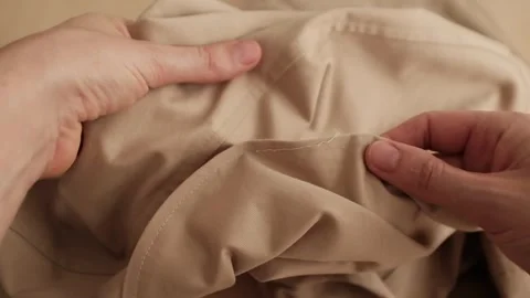 Hands touching cotton fabric 库存影片 316920656