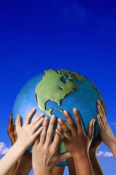 Hands Touching A Globe Stock Photos