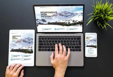 Hands touching responsive web design devices Stock Photos