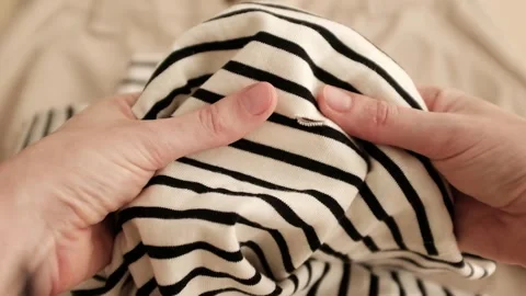 Hands touching striped fabric 库存影片 316920651