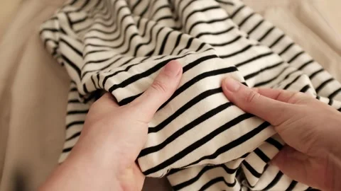 Hands touching striped fabric Stock Footage 316920652