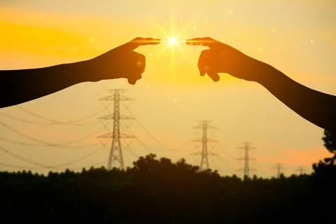Hands Touching Under Bright Light, Energy Transfer Concept with Power Lines.. Stock Photos