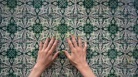 Hands touching wall with green azulejo tiles Stock Footage 255290956