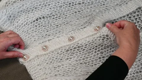 Hands touching white mohair fabric, soft knitted textile texture. Stock Footage 334753084
