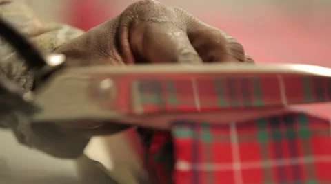 Hands trimming a texture corner Stock Footage 31445144