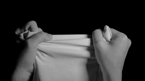 Hands try to tear a white cloth. Видео 149058075