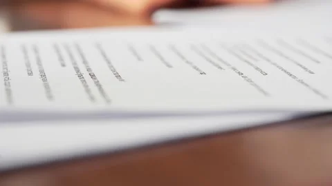 Hands trying to find the page. Hands and stack of paper Video stock 135826654