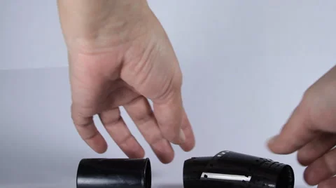 Hands Trying To Put Back Photo Film In Case, Isolated On White, Analog, Photo Stock Footage 40899196