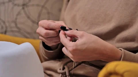 Hands Trying to Thread White Thread - Symbol of Perseverance in Craft - Close Up 動画素材 296216356