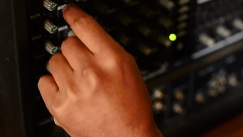 Hands turning knobs to an electric amplifier. 動画素材 93416452