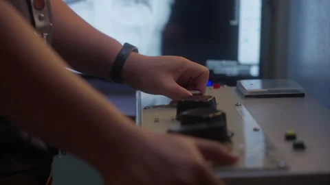 Hands Turning Knobs Of A Machine. closeup 動画素材 243952161