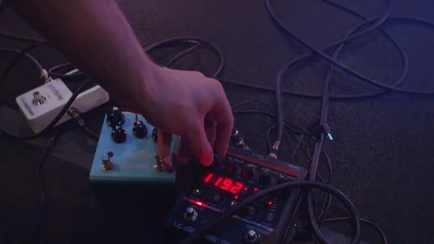 Hands turning musical knobs Stock Footage 127102489