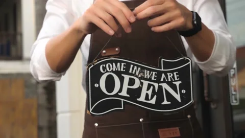 Hands Turning Open Sign Stock Footage 142940630
