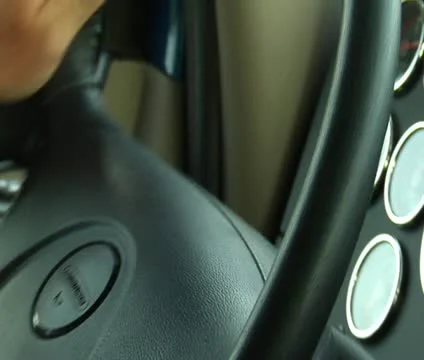 Hands turning steering wheel Stock Footage 21632540