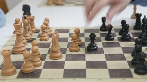 Hands of a two chess players and black pawn take white pawn Stock Footage 36265535