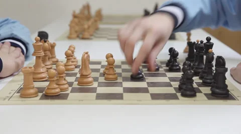 Hands of a two chess players and black pawn take white pawn Stock Footage 36265559