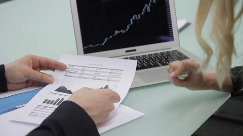 Hands of two colleagues, who are discussing the bitcoin rates, close up. Stock Footage 85375369