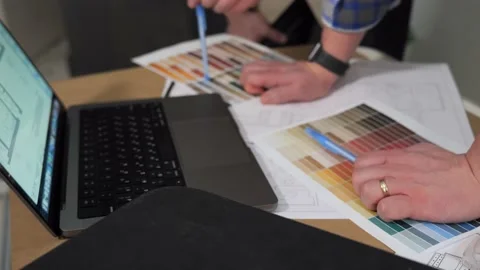The hands of two engineers point to the drawing with their pens Stock Footage 236507706