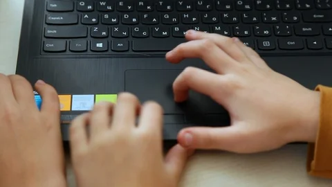 Hands of two kids programing their just built computerized robots using laptop 스톡 동영상 87036423