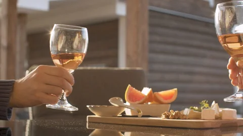 Hands of two people clinks wine glasses Stock Footage 129251462