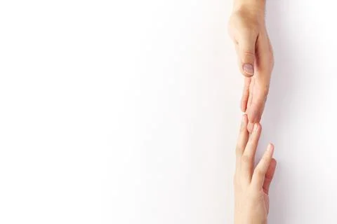 The hands of two people touch each other's fingers Stock Photos