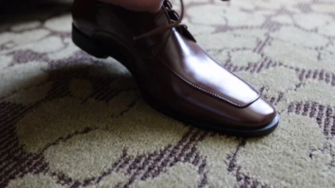 Hands tying brown shoes close up Video stock 111400484