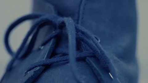 Hands tying shoelaces on boot, closeup Stock Footage 82827891