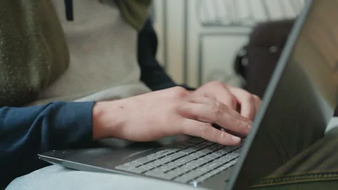 Hands type coffee. Close viewing of fingertips pressing keys while working with Stock Footage 335405287