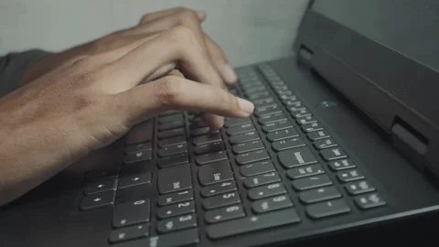 Hands type fast on black laptop keyboard Stock Footage 340906318