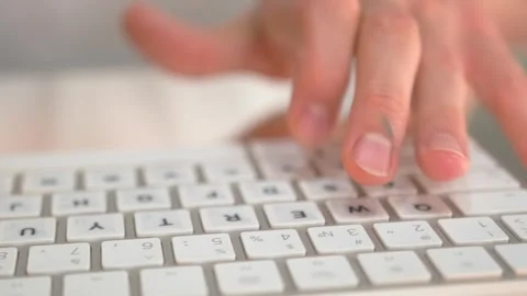 Hands type on keyboard, emphasizing precision and task focus. Video stock 294162823