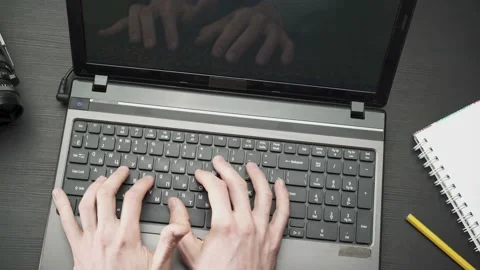 Hands type on laptop keyboard Stock Footage 150945554