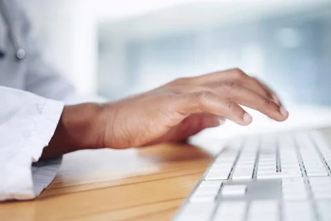 Hands, typing and doctor with computer in hospital for medical report, rese.. Stock Photos