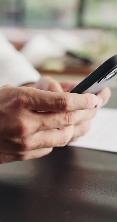 Hands, typing and freelancer with smartphone, online and communication with Stock Footage 330921199