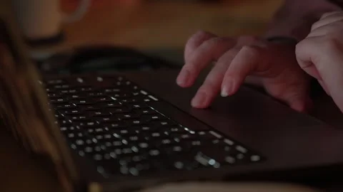 Hands Typing and Using Laptop Touchpad in Warm Light Stock Footage 344946608