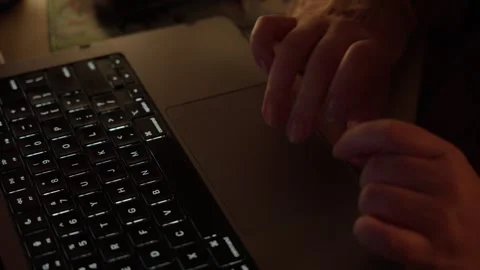 Hands Typing and Using Laptop Touchpad in Warm Light Stock Footage 344947987