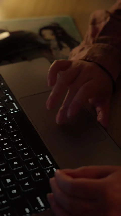 Hands Typing and Using Laptop Touchpad in Warm Light Stock Footage 344950490