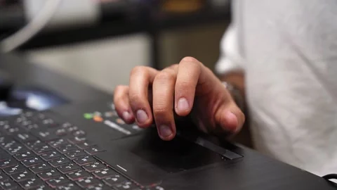 Hands typing on blue backlit laptop keyboard Stock Footage 336648693
