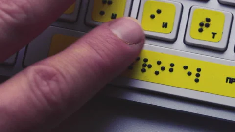 Hands typing on a Braille keyboard. Close-up, fingers moving across tactile keys Stock Footage 319055806