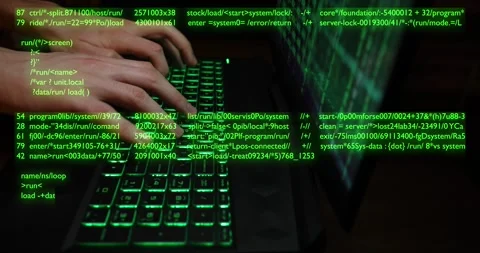 Hands typing code on a laptop keyboard, hacking or programming concept Stock Footage 260496482