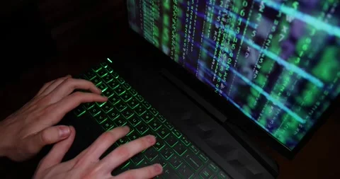 Hands typing code on a laptop keyboard, hacking or programming concept Stock Footage 263112214