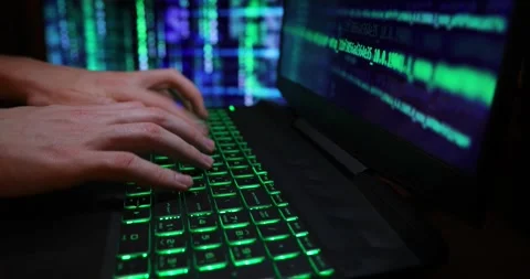 Hands typing code on a laptop keyboard, hacking or programming concept Stock Footage 263112219