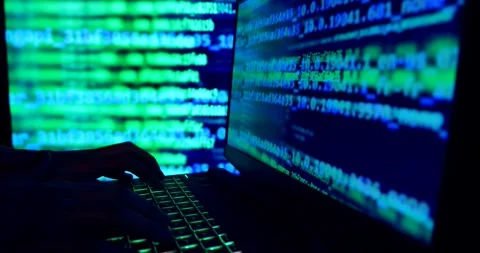 Hands typing code on a laptop keyboard, hacking or programming concept Stock Footage 300398028