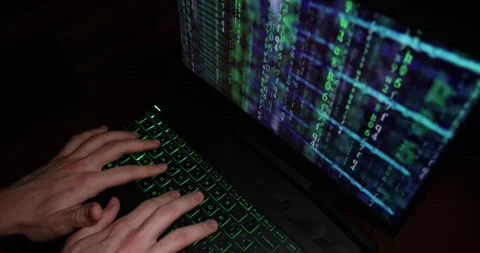 Hands typing code on a laptop keyboard, hacking or programming concept Stock Footage 300398035