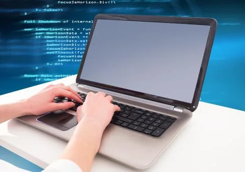 Hands typing coding text on laptop Foto stock