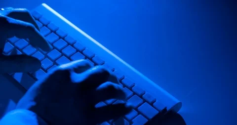 Hands typing on computer bluetooth keyboard with some blue light of office work 스톡 동영상 87459247