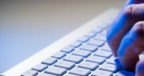 Hands typing on computer bluetooth keyboard with some blue light of office work 스톡 동영상 87459696