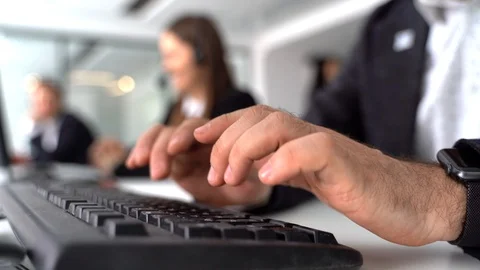 Hands typing on a computer, close-up, a call center employee responds to a Stock Footage 127423870