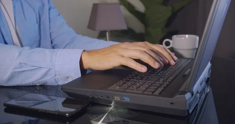 Hands typing on computer keyboard, business man working on laptop pc in office Stock Footage 123040316